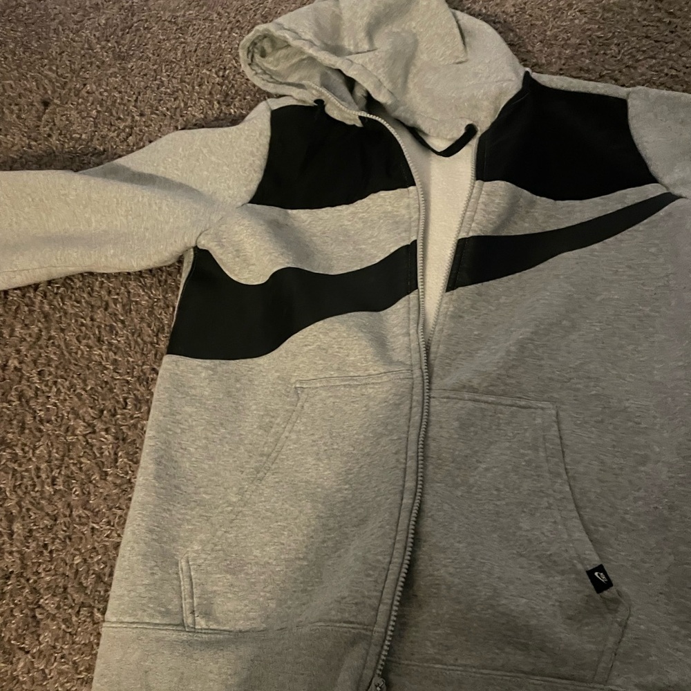 Nike men’s jacket with faux leather across the chest.